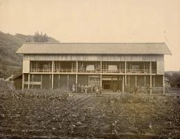The front gate in the early Meiji era. The ground floor was a stable; silkworms were raised upstairs.